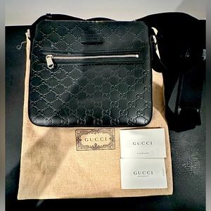 Men’s Gucci monogram messenger bag